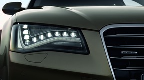 LED automotive application of daylight running lights in headlight cluster for Audi A8.